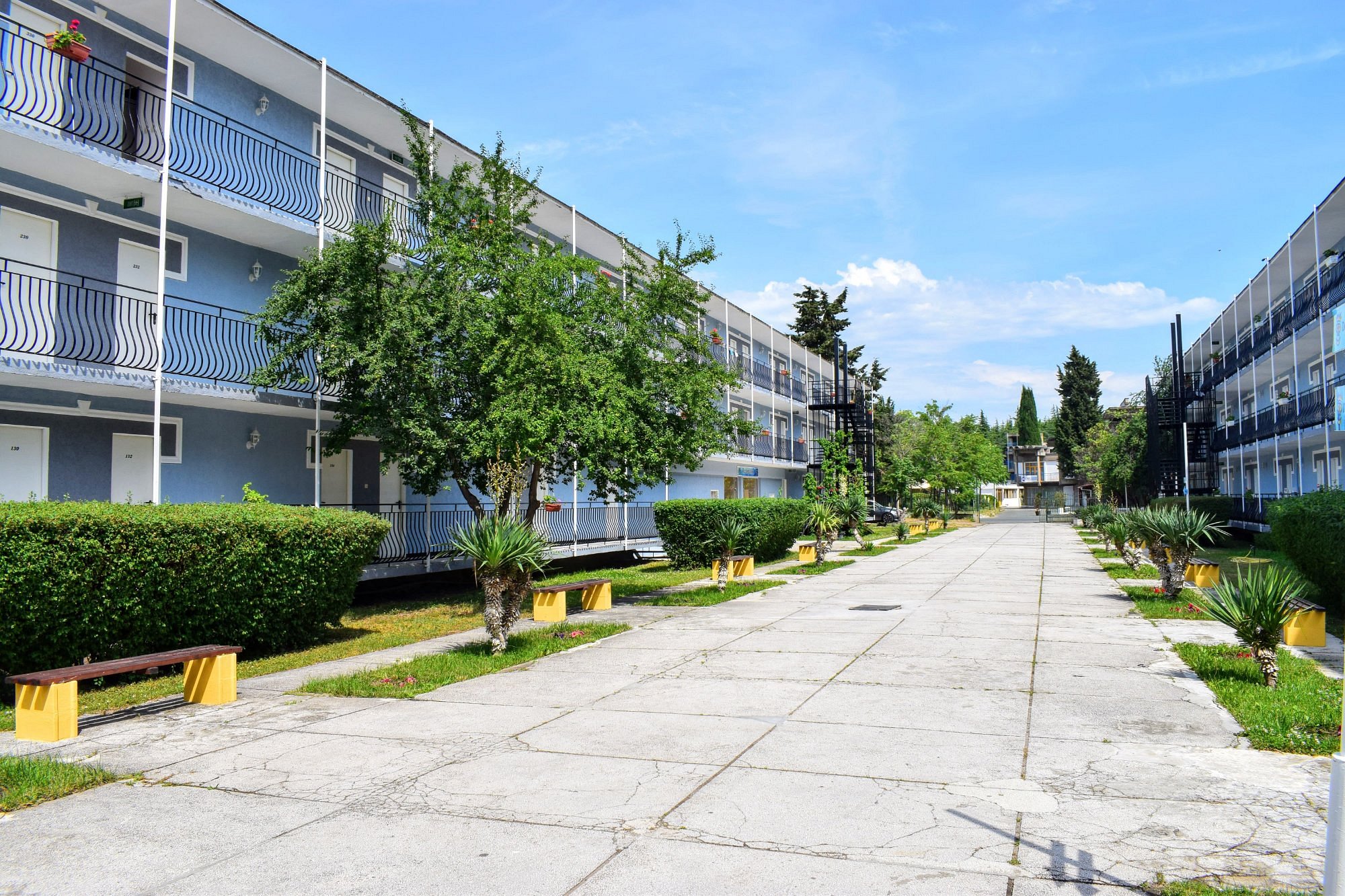 Garden path between hotel buildings